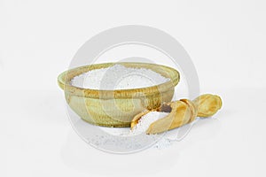 Sugar in a wooden Cup with a spoon for spices isolated on a white background. Collection of spices and herbs