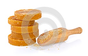 Sugarcane Hard Molasses or Jaggery and sugar in scoop