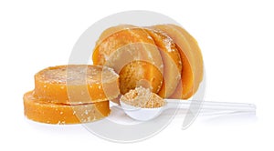 Sugarcane Hard Molasses or Jaggery and sugar in spoon