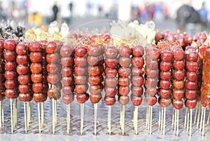 Sugarcoated haws on a stick