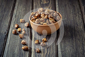 Sugared peanuts in a brown bowl