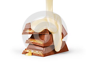 Suger milk pouring on chocolate bar isolated