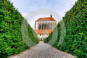Suggestive view of the Church of the Virgin Mary of the Snow from the Garden of the Franciscans in Prague