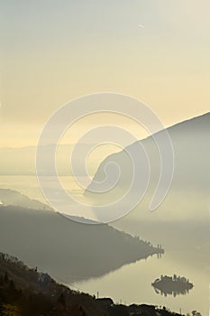 An suggestive view of Lake Iseo at sunset with the fog photo