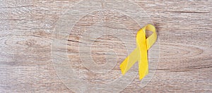 Suicide prevention and Childhood Cancer Awareness, Yellow Ribbon for supporting people living and illness. children Healthcare and