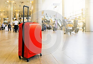 Suitcase in airport airport terminal waiting area with lounge zone as a background. Traveling luggage in airport terminal. Vacatio