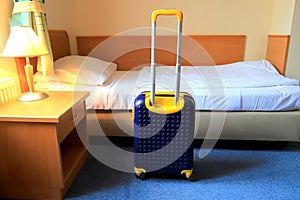 Suitcase, Backpack on bed in bedroom. A bag in hotel room, hostel, rented apartment. Travel, holidays, vacation