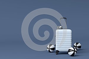 Suitcase with beach ball and flip flops on black and white background.