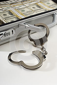 Suitcase With Dollars And Handcuffs