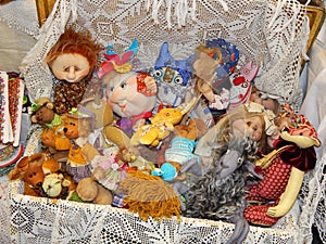 A suitcase full of dolls. Handicrafts.