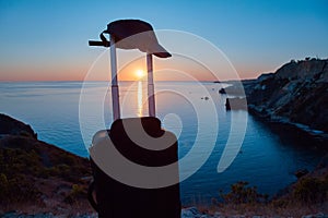 Suitcase with hat for travel. Sunset view. Summer holiday orTravel desire. Vacation abroad or Virgin nature. Copy space