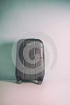 Four wheeled hard shell black suitcase
