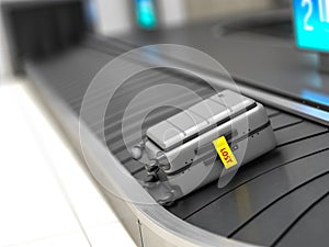 Suitcase with lost sticker on an airport baggage conveyor or baggage claim transporter