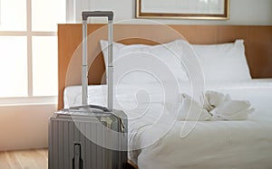 Suitcase or luggage bag near by bed in a modern hotel room