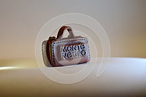 Suitcase made of clay, with country inscription