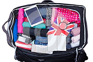 Suitcase opened with full of clothing