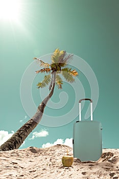 Suitcase at palm tree on the beach of tropical Island. Summer holiday and travel concept.