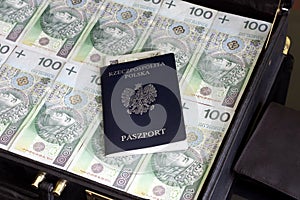 Suitcase passport and polish money corruption concept photo