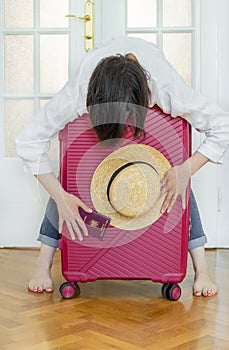 Suitcase pink passport Romanian hand woman big luggage baggage hat summer door