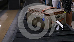 A suitcase with things is traveling around the luggage at the airport. HD