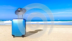 Suitcase with woman sun hat on sea beach. Travel baggage concept.