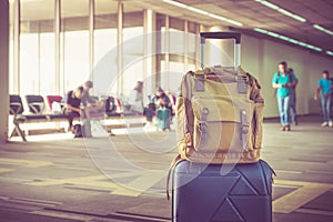 Suitcases and backpack in airport departure terminal with travel