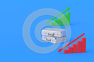 Suitcases near charts with up, down arrow. Forecasting profitability of investments