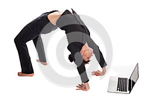 Suited Woman In Yoga Pose working with Laptop.