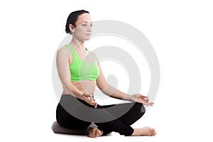 Sukhasana yoga pose with pillow