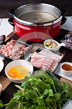 Sukiyaki . Preparation of raw materials,beef,egg ,tofu,vegetable and mung bean noodle  for sukiyaki using hot pots