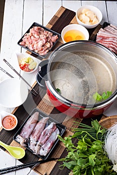 Sukiyaki . Preparation of raw materials,beef,egg ,tofu,vegetable and mung bean noodle  for sukiyaki using hot pots