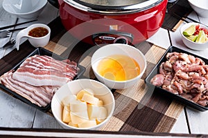 Sukiyaki . Preparation of raw materials,beef,egg ,tofu,vegetable and mung bean noodle  for sukiyaki using hot pots