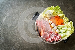 Sukiyaki or shabu hot pot black soup with meat raw and vegetable