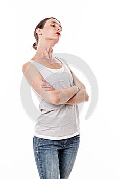 Sulking woman with arms folded posing with chin up for arrogance