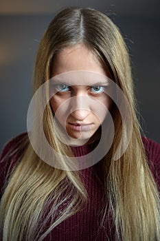 Long haired caucasian girl with a crazy look photo