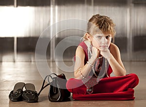 Sullen young girl in red