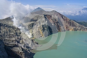 Sulphatic lake in a crater of volcano Ijen