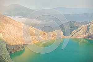 Sulphatic lake in a crater of volcano Ijen