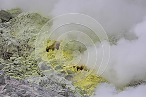 Sulphur pieces on Iozan (sulfur mountain) active volcano area, Akan National Park, Hokkaido, Japan