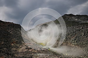 Sulphur pieces on Iozan (sulfur mountain) active volcano area, Akan National Park, Hokkaido, Japan