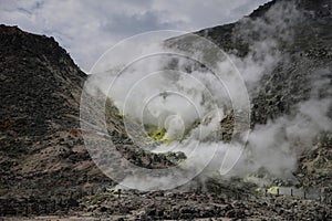 Sulphur pieces on Iozan (sulfur mountain) active volcano area, Akan National Park, Hokkaido, Japan