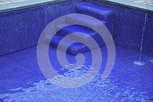 sulphurous, Swimming pool steps with clear water surface background, nobody. Abstract pool texture, underwater pattern blue