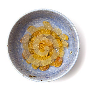 Sultanas in a small ceramic bowl