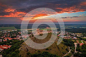 Sumeg, Hungary - Aerial panoramic view of the famous High Castle of Sumeg in Veszprem county at sunset with storm clouds
