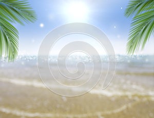 Summer abstract background green palm leaf and blur beautiful nature on the tropical beach with bokeh glitter sunlight
