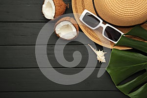 Summer accessories with coconuts on black background