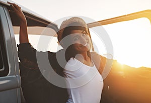 Summer activated. an attractive young woman enjoying a road trip.