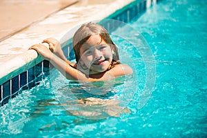 Summer activities for happy child on the pool. Child relax in summer swimming pool.