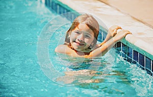 Summer activities for happy child on the pool. Child relax in summer swimming pool.