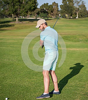 summer activity. professional sport outdoor. male golf player on professional golf course.